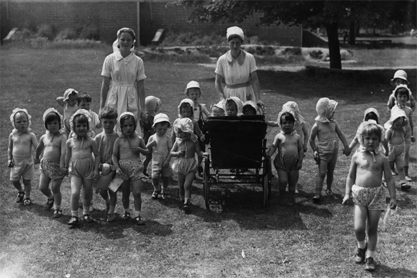 8th July 1941: A group of children whose homes have been destroyed by World War II bombing raids enjoy a walk in the English countryside to which they have been evacuated. (Photo by Fred Morley/Fox Photos/Getty Images)