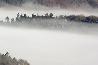 Morning mist in the valleys of northeast Dartmoor, seen from the summit of Brent Tor