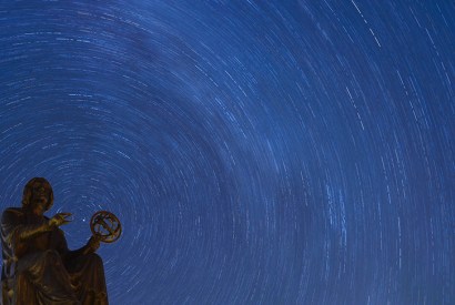 Stars rotate behind the Copernicus Monument in Chicago. Credit: Getty Images